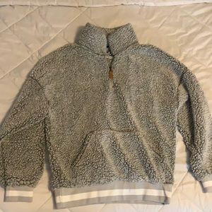 medium fuzzy pull over half zipped